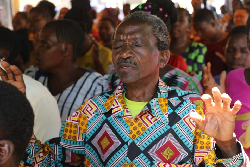 Altar call as people commit to follow Christ