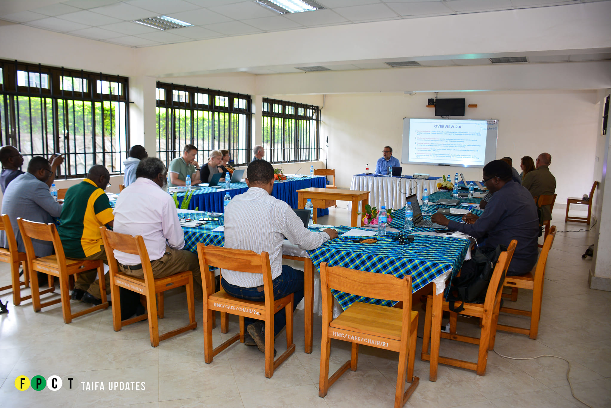 Staff in discussion at an FPCT facility