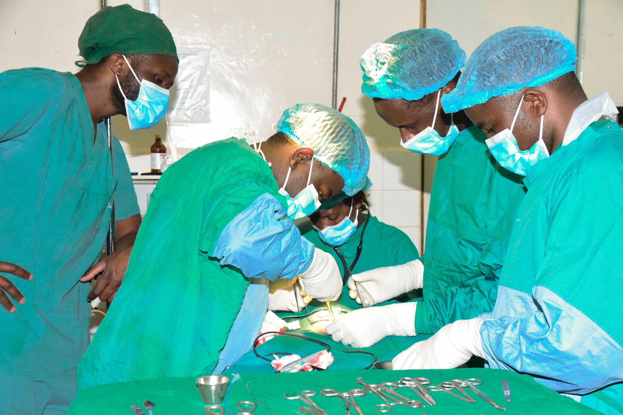 Surgeons operating in theatre